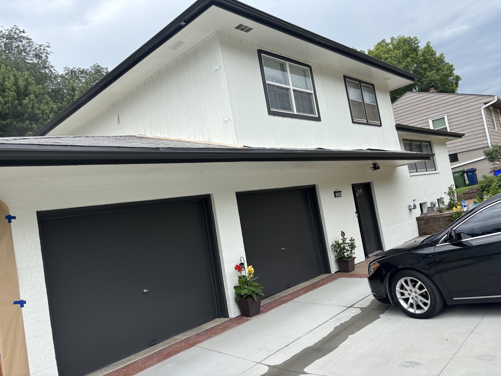 Full exterior house repaint with dark garage doors, Bellevue